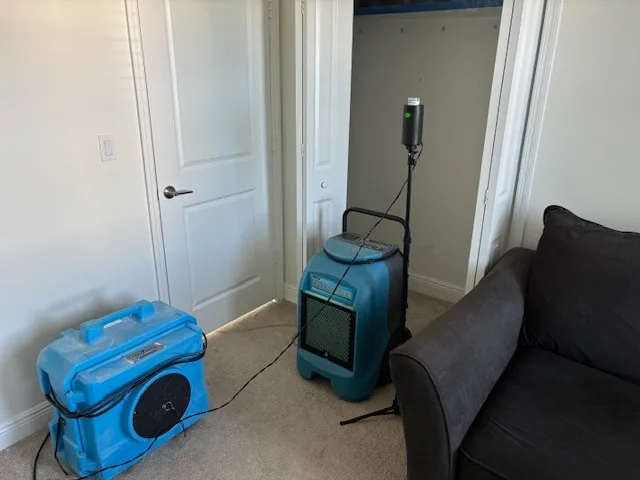 Post-remediation verification with air scrubber and dehumidifier in treated room